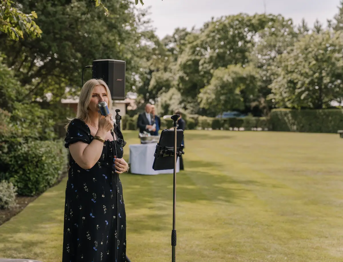 Female wedding and events singer Nicola Mason performing live acoustic music