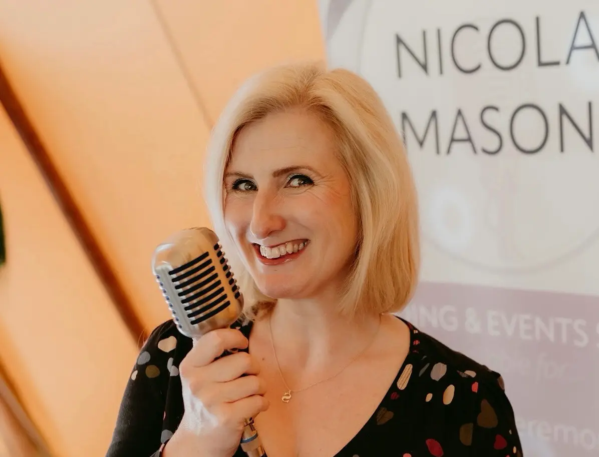 Award-winning female wedding singer Nicola Mason performing live music at Scottish wedding